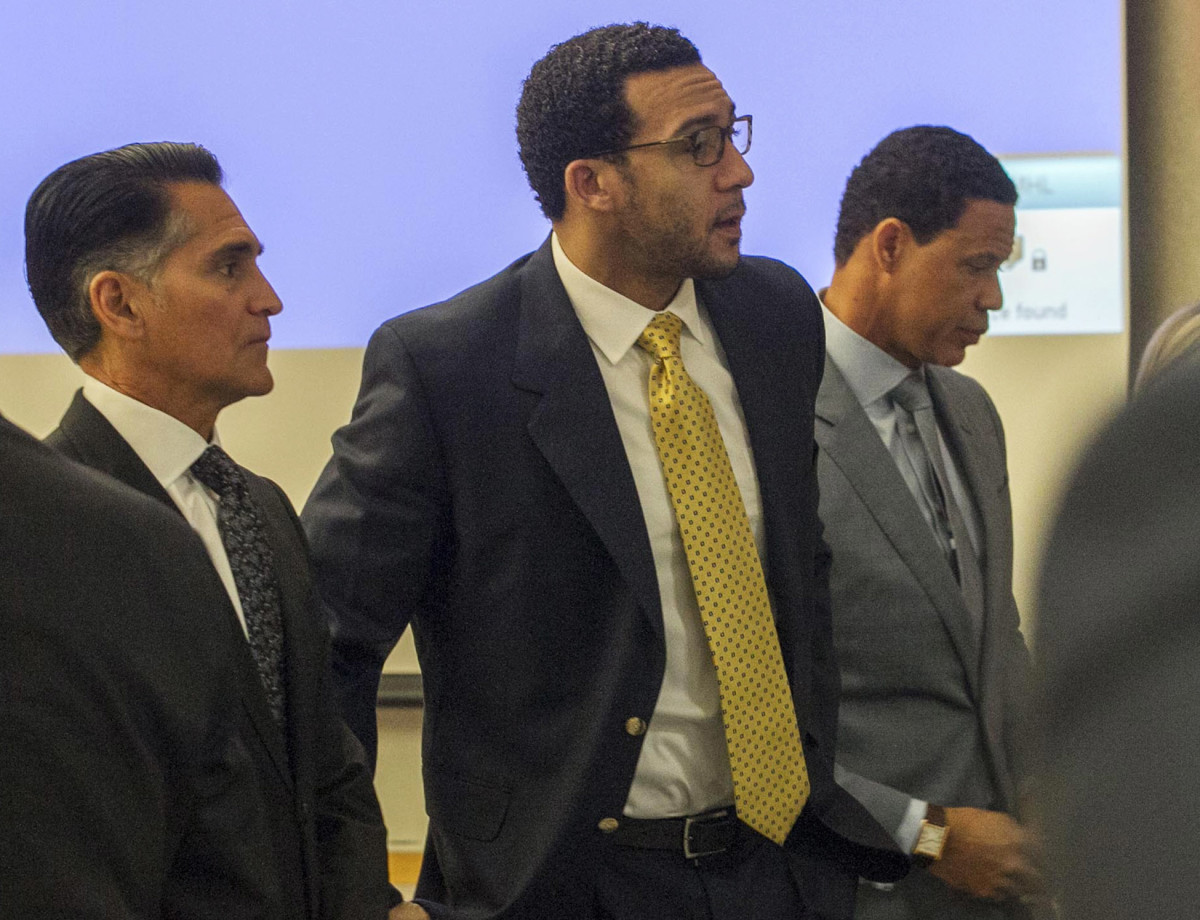 Winslow (center), flanked by trial attorneys Marc Carlos (left) and Brian Watkins (right).
